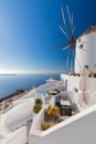 Old white windmill in Oia in Santorini, Greece. Tradition white buildings of famous Santorini island Royalty Free Stock Photo