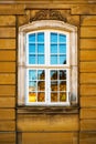 Old white window and yellow building facade, Copenhagen, Denmark Royalty Free Stock Photo