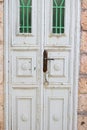 Old white wood door with Openwork green lattice as beautiful vintage background Royalty Free Stock Photo