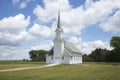 Old white wooden church on the prairie