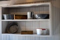 Old white wooden shelf in a kitchen, interior of a house from the antique west Royalty Free Stock Photo