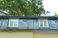 Old white wooden window with layout and rebate roof