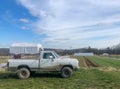 Old white work pick up truck on organic farm Royalty Free Stock Photo