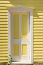 Old white and yellow door Royalty Free Stock Photo