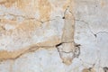 Old whitewashed background texture of a weathered distressed cracked concrete cement stone wall Royalty Free Stock Photo