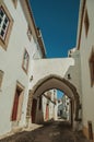 Old whitewashed houses in alley and passageway under arch Royalty Free Stock Photo