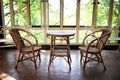 Old Wicker Bistro Table and Chairs in Sun Room Patio of Historic