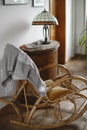 Old wicker rocking chair in cozy home, living room interior Royalty Free Stock Photo