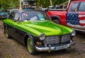 Classic wild green and black Volvo Amazon parked