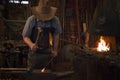 Old Wild West Blacksmith Hammering Royalty Free Stock Photo