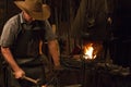 Old Wild West Blacksmith Hammering Royalty Free Stock Photo