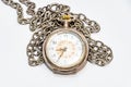 Old wind up pocket watch worn with silver chain Royalty Free Stock Photo