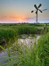 Old windmill in agricultural area Royalty Free Stock Photo