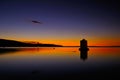 Old windmill in harbor of orbetello Royalty Free Stock Photo