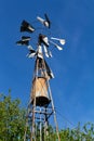 Old windmill made of metal to extract water. Royalty Free Stock Photo