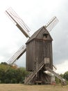 Old windmill made of wood in the field