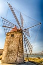 Old windmill for salt production, Sicily, Italy Royalty Free Stock Photo
