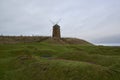 The old single Windmill at St Monans on the east coast of Scotland, looking over the Salt Pans. Royalty Free Stock Photo