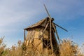 An old windmill standing in a field. Royalty Free Stock Photo