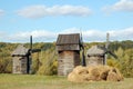 Old windmill and straw roll Royalty Free Stock Photo