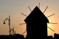 Old windmill and street lights sunset Nessebar Bulgaria Royalty Free Stock Photo