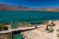 Old windmills and canal on a narrow causeway and site of an ancient Minoan city Royalty Free Stock Photo