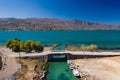 Old windmills and canal on a narrow causeway and site of an ancient Minoan city Royalty Free Stock Photo