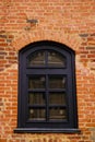 Old window on the background of a yellow brick wall Royalty Free Stock Photo