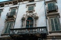 Old window balcony with stone carving on the street of Verona, Italy Royalty Free Stock Photo