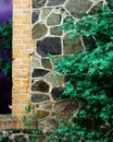 Old window with a brick wall with green grass, selective focus, warm toned