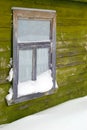 The old window brought by a snow