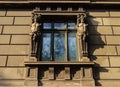 Old window with caryatids