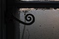 Old window with condensation on glass in winter - focus is on handle Royalty Free Stock Photo