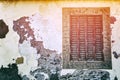 Old window with cracky wooden shutters