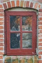 Old, window and exterior with brick wall of abandoned house, building or wooden frame. Glass of historic outdoor home Royalty Free Stock Photo