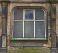 Old window frame sand stone building