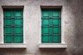 Old window frame with steel bars shutter exterior as prison or residential apartment front view. Weathered house wall Royalty Free Stock Photo