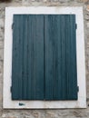 The old window with green - blue closed shutters on an old house. Vintage texture. Herceg Novi Montenegro, old stone Royalty Free Stock Photo