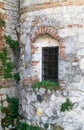 Old window grille of a ruined castle Royalty Free Stock Photo