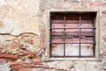 Old window with iron gratings Royalty Free Stock Photo