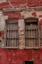 Old window with lattice on the ancient brick wall background Royalty Free Stock Photo