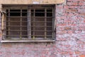 Old Window With Lattice On Brick Wall