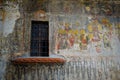 Old window and a painted church wall. Relegious church art.