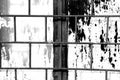 Old window painted white paint behind a rusty bars, black and white Royalty Free Stock Photo