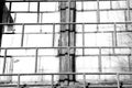 Old window painted white paint behind a rusty bars, black and white Royalty Free Stock Photo