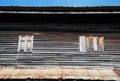 old window and roof of wood home in kanchanaburi thailand