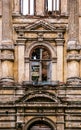 An old window in ruined mansion. Facade of the old burnt house