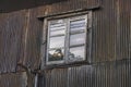 Old window and rusty corrugated wall Royalty Free Stock Photo