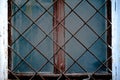 Old window with an rusty grating on a old wall with bricks Royalty Free Stock Photo