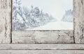 Old window sill in front of magical winter landscape